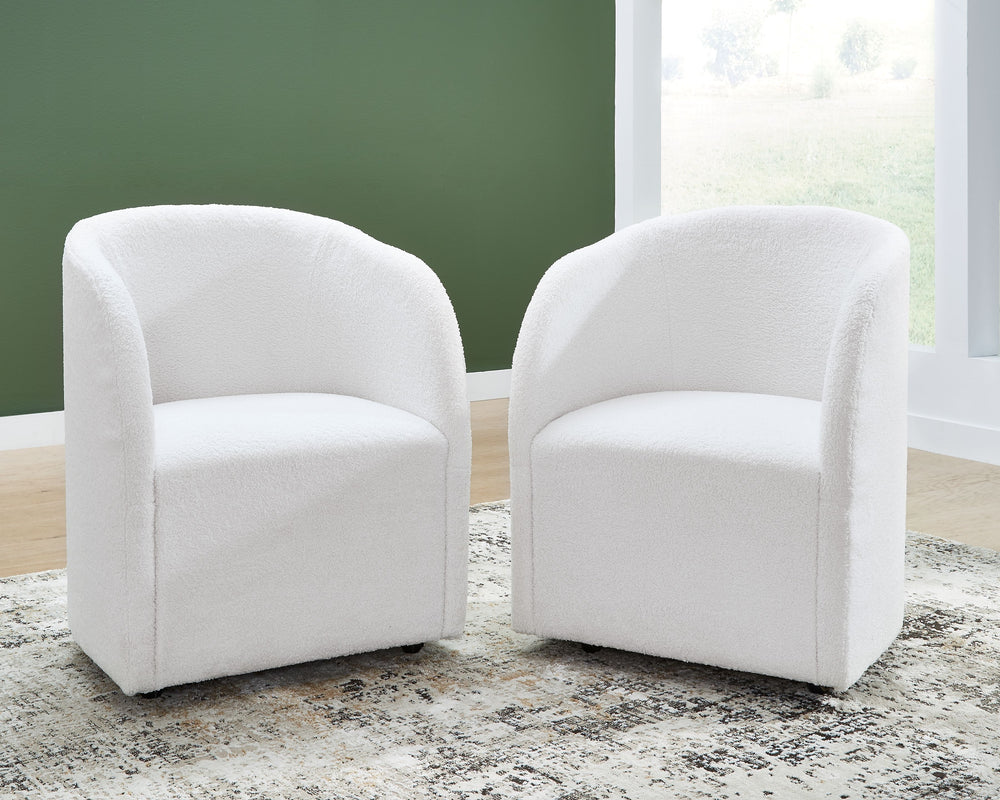 Inspired by art deco design, this fully upholstered dining chair makes a lasting impression in a simply stunning way. Its magnificent curved silhouette is enhanced with a neutral boucle upholstery thatâ€™s so pleasing to the palate. This is the piece youâ