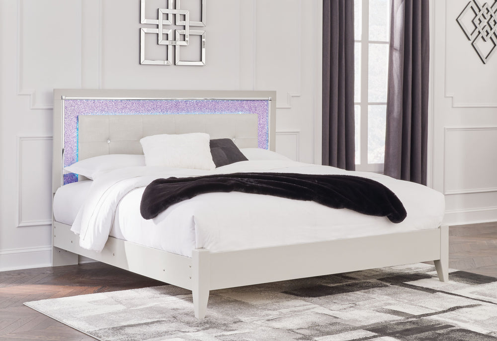 Bright, bold luxury. This king upholstered bed dazzles with its attention to detail. Your love of glamorous style is reflected in the tufted upholstery with faux alligator effect, exquisitely paired with faceted chrome-tone and glittery details. Complete 