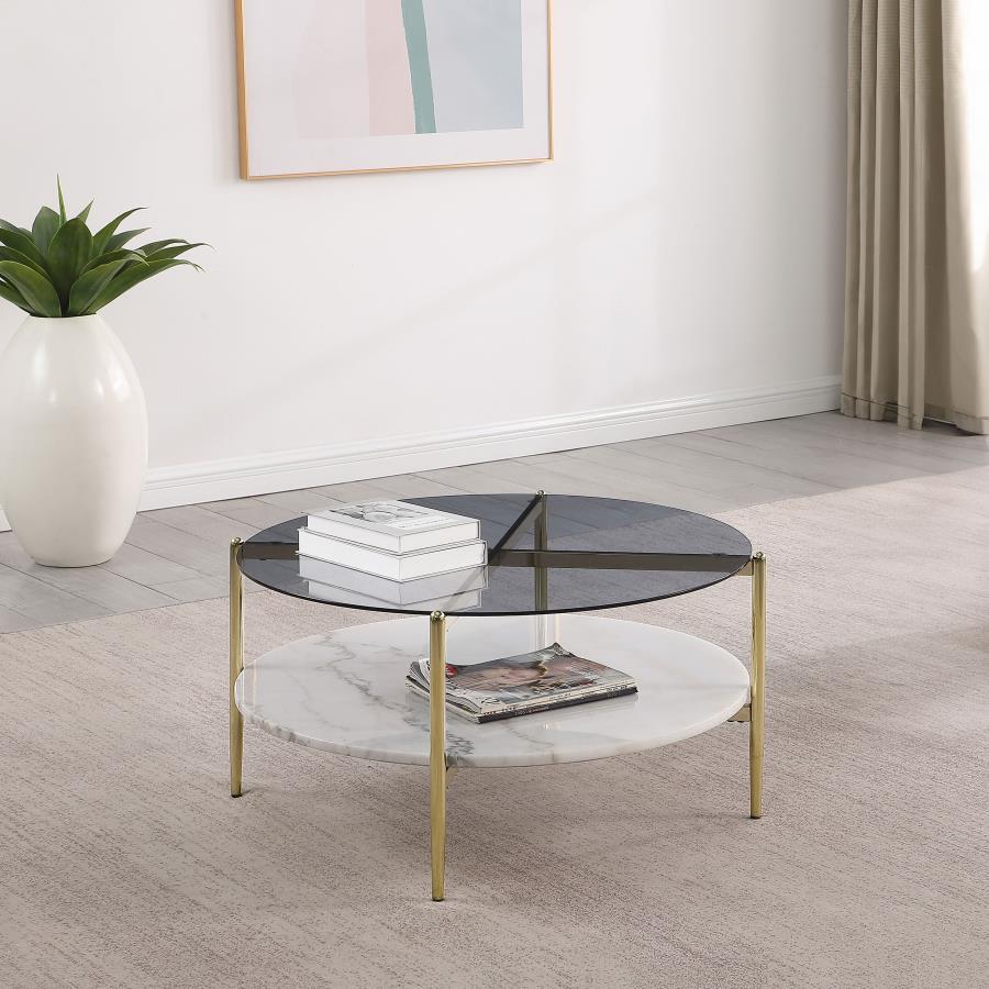 A luscious look, this modern coffee table creates a glamorous aura with its sleek glass and white marble elements. The round smoked tempered glass top rests upon a gleaming white marble shelf, bringing sophistication to any living room. The gold electropl