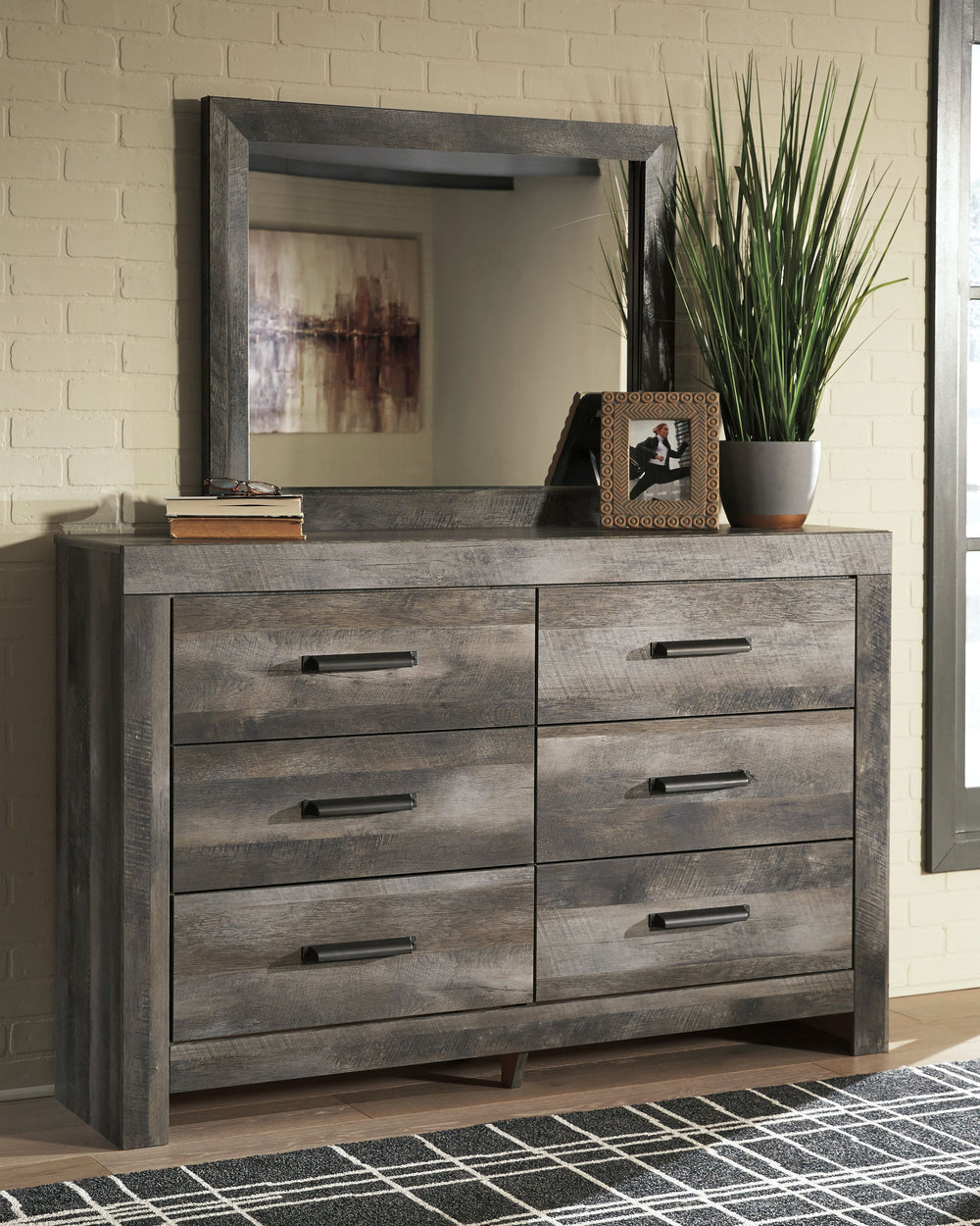 This crossbuck panel bedroom group is sure to win your heart with its daring designer take on modern rustic. This bedroomâ€™s crisp, clean and minimalist-chic profile is enriched with a striking replicated oak grain with thick plank styling and a weathere