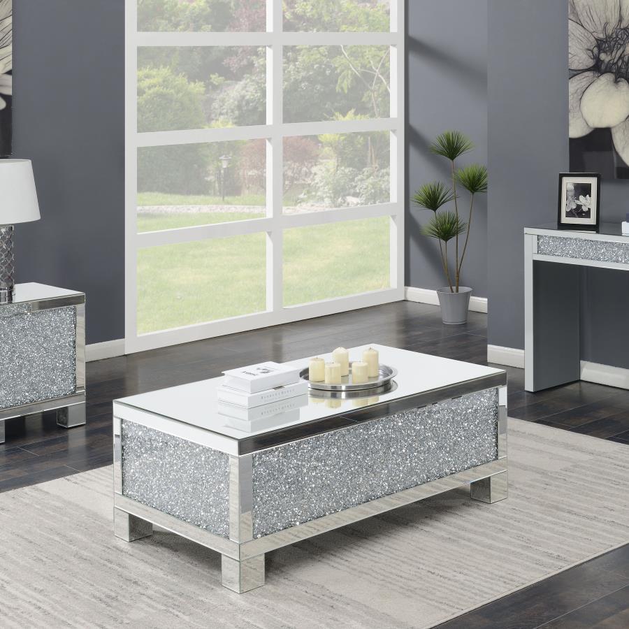 This 48-inch rectangular mirrored coffee table is the perfect centerpiece for a glam living room. Designed with an engineered wood frame, it features fully mirrored surfaces that reflect light beautifully, while acrylic crystal accents provide dazzling sp