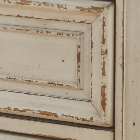  this dresser is your dream bedroom retreat realized. Its antiqued two-tone aesthetic blends a chipped white with a distressed wood finished top for added charm. Framed drawer fronts and decorative corbels 