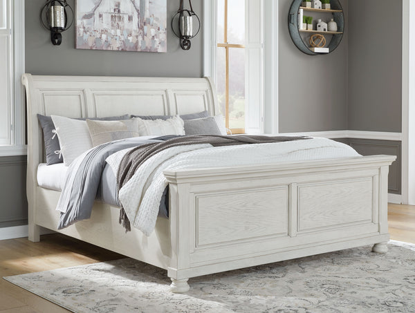  timeless furnishings take your bedroom to the next level. Nothing does that better than this king sleigh bed. The antiqued white finish with a wonderful grain texture radiates sophistication