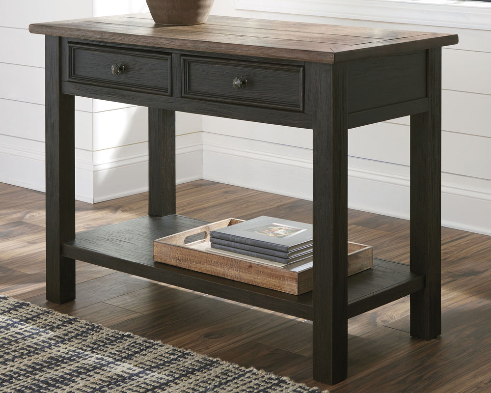 Shabby chic with a hint of down-home country, this sofa table is all the talk of todayâ€™s design world. Wood grain shows through the weathered gray-brown top in all of its earthy pleasure. And the framed drawers, adorned with lovely traditional hardware,