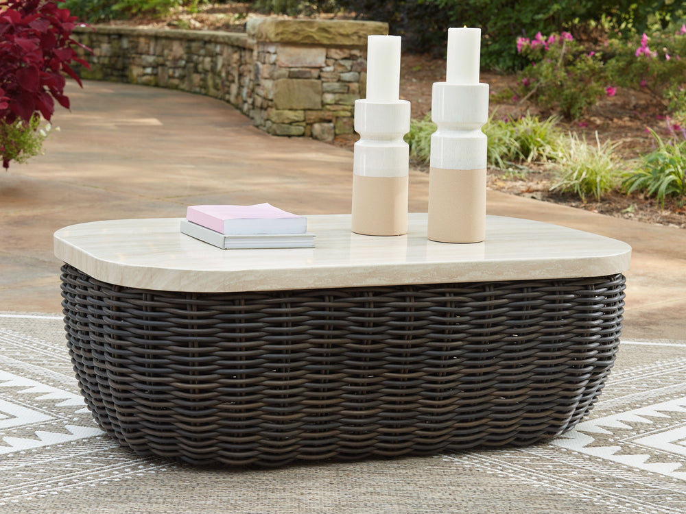 Add luxury, convenience and durability to alfresco fun. This outdoor coffee table captures the textural beauty of wicker while withstanding the elements, from rain to shine. With its marble-look aluminum top, you can stylishly stage decor or keep snacks a