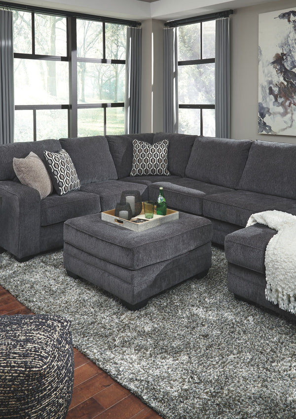  contemporary style and long on comfort. Plushly upholstered in a slate gray fabric