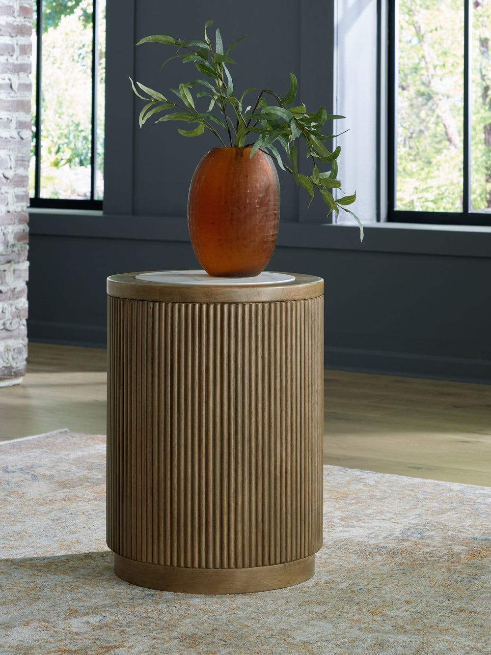 Elegance meets earthy charm in this end table. Crafting a contemporary living room? The faux marble top expertly pairs with the reeded base for a trend-right take on day-to-day function. Itâ€™s an ideal spot to rest remotes, a drink or small decorative ac