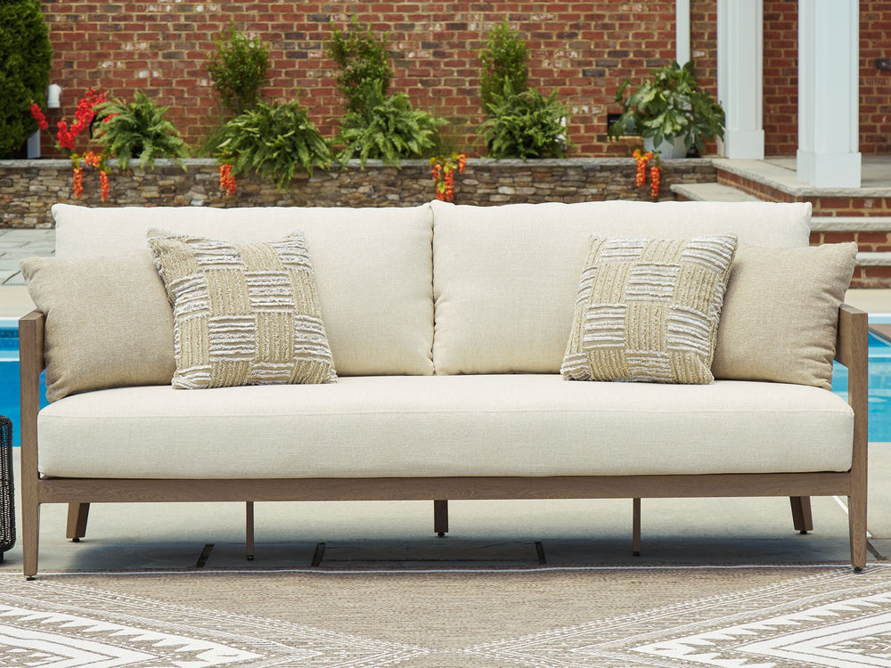 Elevate the appeal of easy-breezy living with this outdoor sofa. Made to look like wood yet durable enough to weather the elements, it-'s sure to serve you and your besties well, year after year. The gently curved piece features cushions wrapped in Nuvell