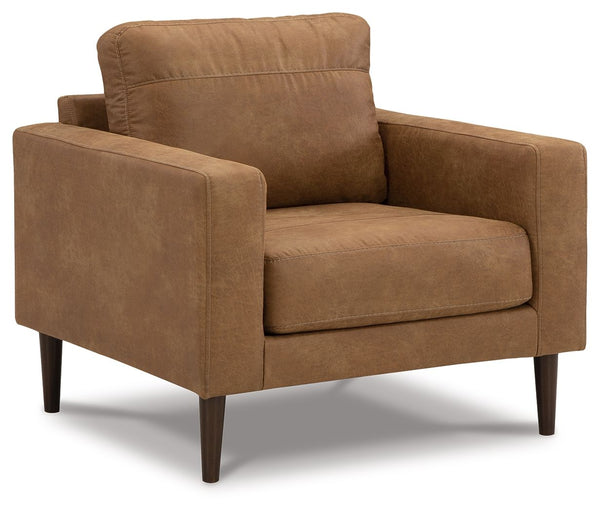 Small-scale style, tailored to perfection. This chair echoes retro aesthetics with warm caramel faux leather, while its ultra-linear silhouette incorporates a contemporary edge. Versatile in form and function, the seat suits styles from modern boho to tra