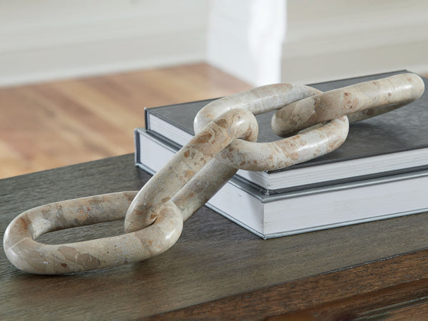  this sculpture connects you with some casually cool art. Its interlocking light beige marble links add a chill vibe to your decor. Adorning a shelf or as a statement piece on its own