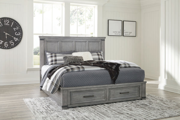 With its light weathered gray coloration, this storage bed conveys trend-right urban farmhouse style. Thick-profiled top moulding on the tall, mansion-scale headboard lends a fresh take on a timeless design. The footboard features two storage drawers with