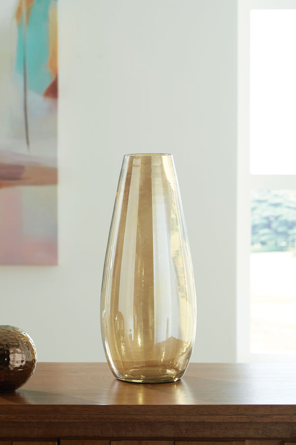  youâ€™re sure to find this vase stunningly on point. Its shimmering amber finish and sleek shape are a feast for the eyes. This show-stopping vessel is gorgeous unadorned or filled with your favorite blooms whether they-'re