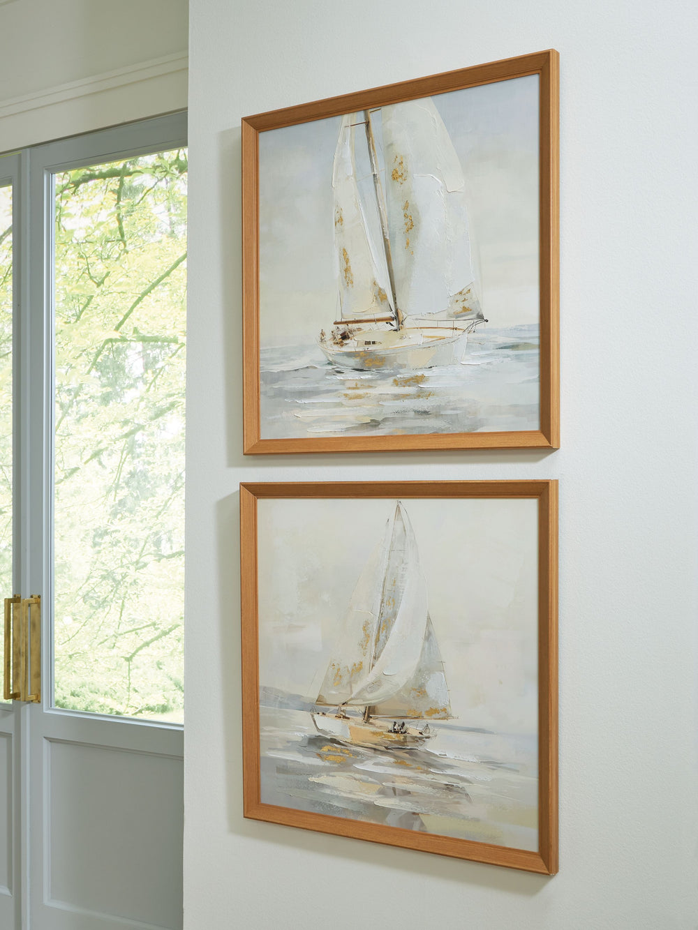 The quiet beauty of sailboats gliding across the water is expertly captured in this wall art set. Soft, dreamy colors and graceful brush strokes evoke a sense of calm and relaxation. Whether they-'re hung together or separately, these beautifully framed c