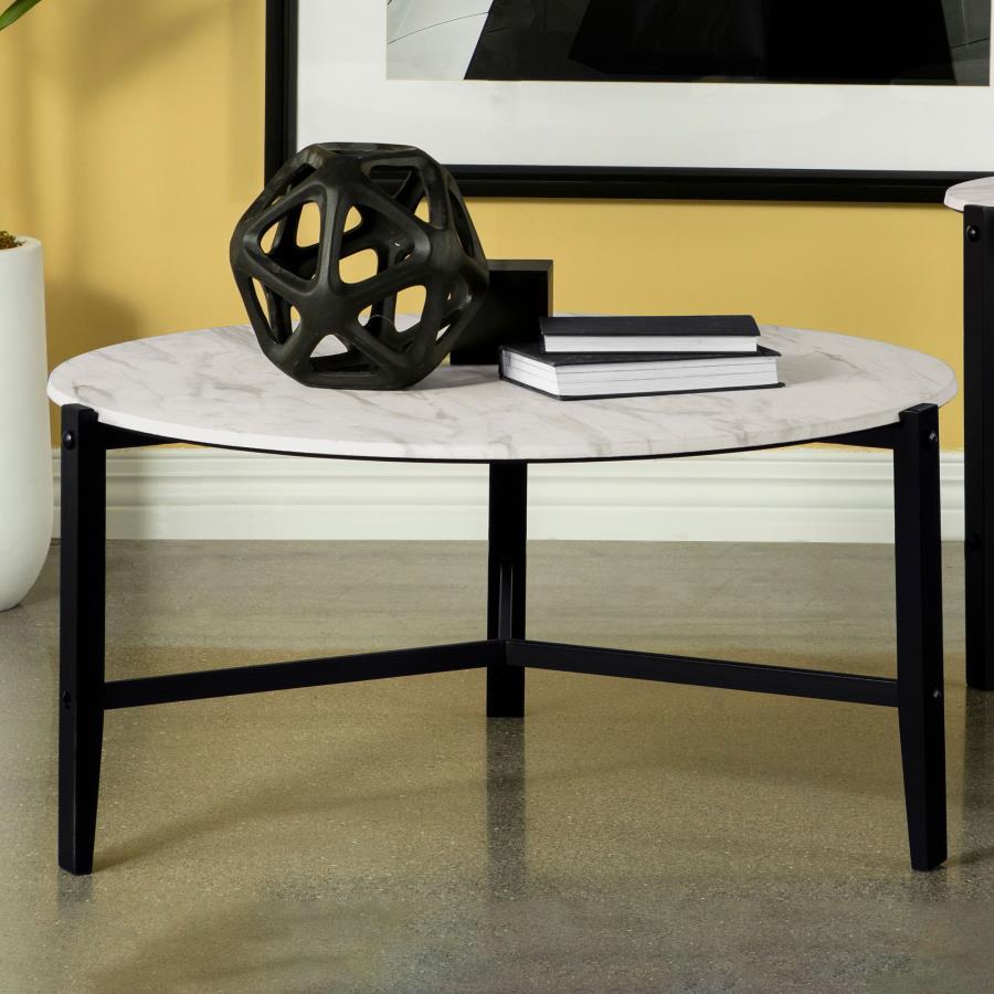 Create a minimal aesthetic in your living room with this modern coffee table. Slim black solid rubberwood legs form a stand-like base that supports a spacious round top. The high-pressure laminate top features a faux white marble design with textured stri