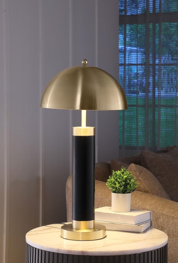 This pair of modern table lamps brings striking contrast with a bold black cylindrical base and gleaming dome-shaped shade. The column silhouette offers sculptural simplicity, while the brushed metal finish adds a sophisticated, polished accent. Ideal as 