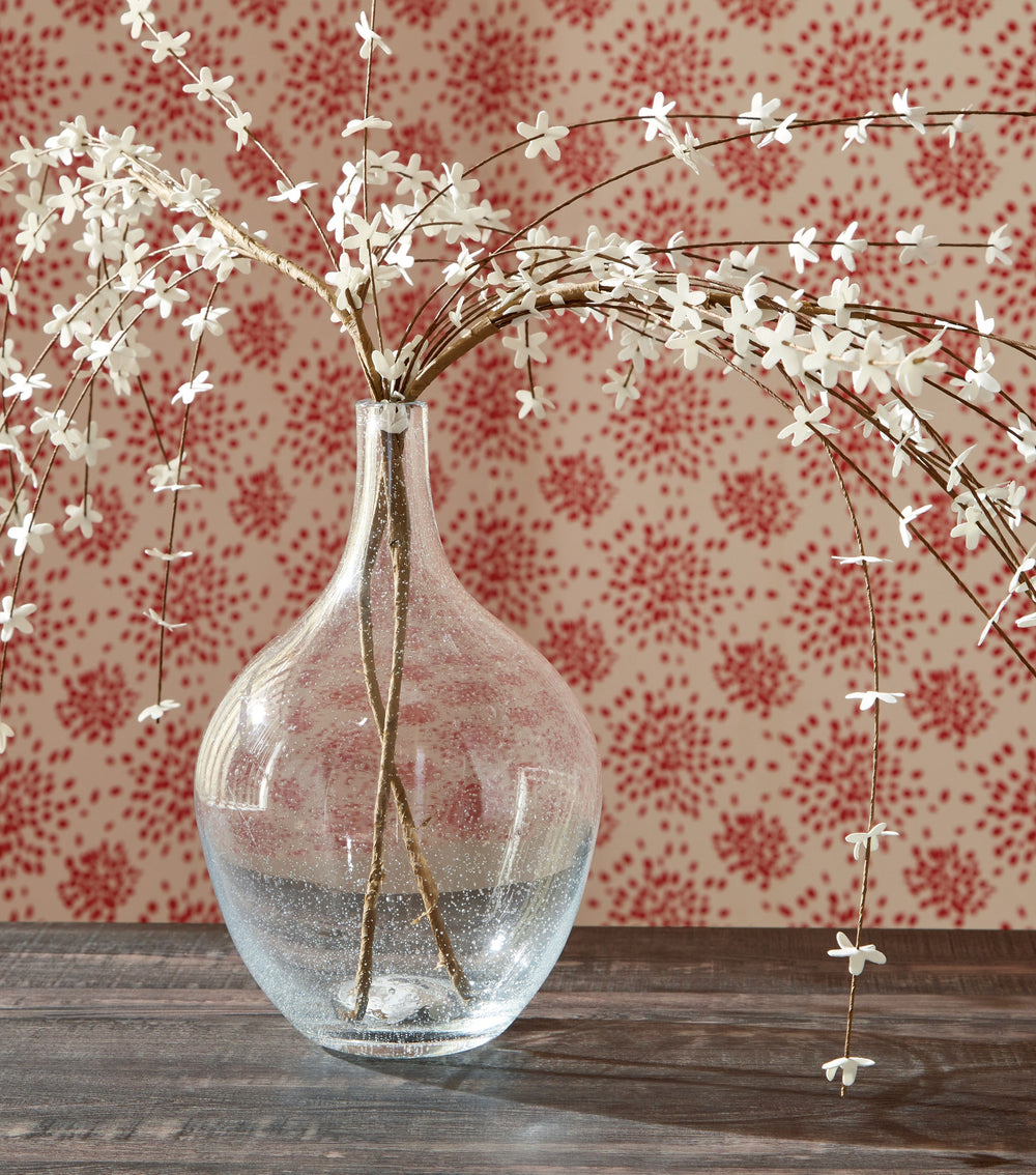 Infuse your shelf, mantel or tabletop with casual charm. Crafted from clear seeded glass, this vase effortlessly captures the essence of weathered beauty. Whether it-'s indoors or outdoors, this vessel is enchantingly simple unadorned or filled with your 