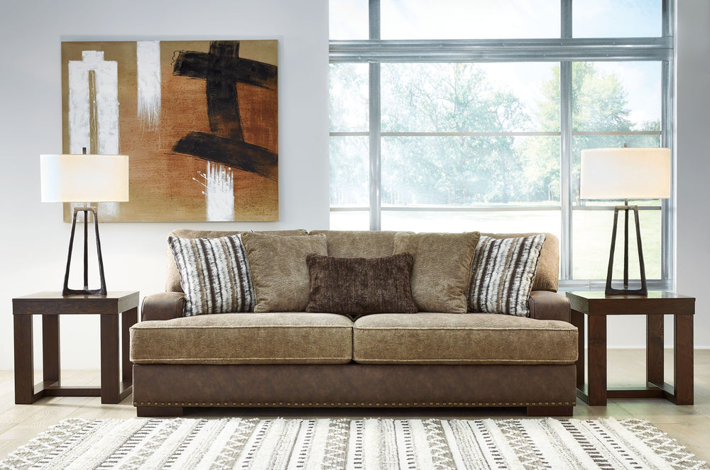 Punctuated by a subtle band of nailhead trim, this sofa is perfect for those who love the look of leather. Two textural tones provide twice the style and comfortâ€”and incorporate an added layer of visual interest. Throw pillows add a fun decorative eleme