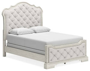 Add a touch of romance to your home with this queen upholstered bed. The antiqued white painted finish and serpentine-shaped silhouette details are the picture of easy elegance. Indulge your love of luxury with decadent button-tufted cushioning from head 