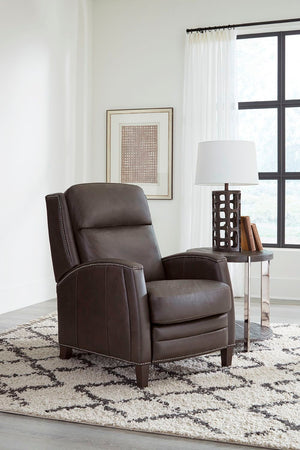 The Vermont power recliner offers a luxurious and effortless power pushback recline feature, allowing you to easily find the most comfortable position for relaxation. It is upholstered in soft leather with custom matching and features decorative nail head