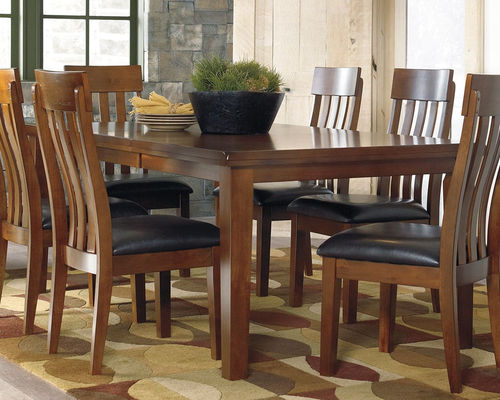 Have an appetite for clean-lined design, but with warmth and rustic character? Satisfaction is served with this dining room extension butterfly table. We love how its gently distressed, burnished finish and plank-style tabletop incorporate depth and chara