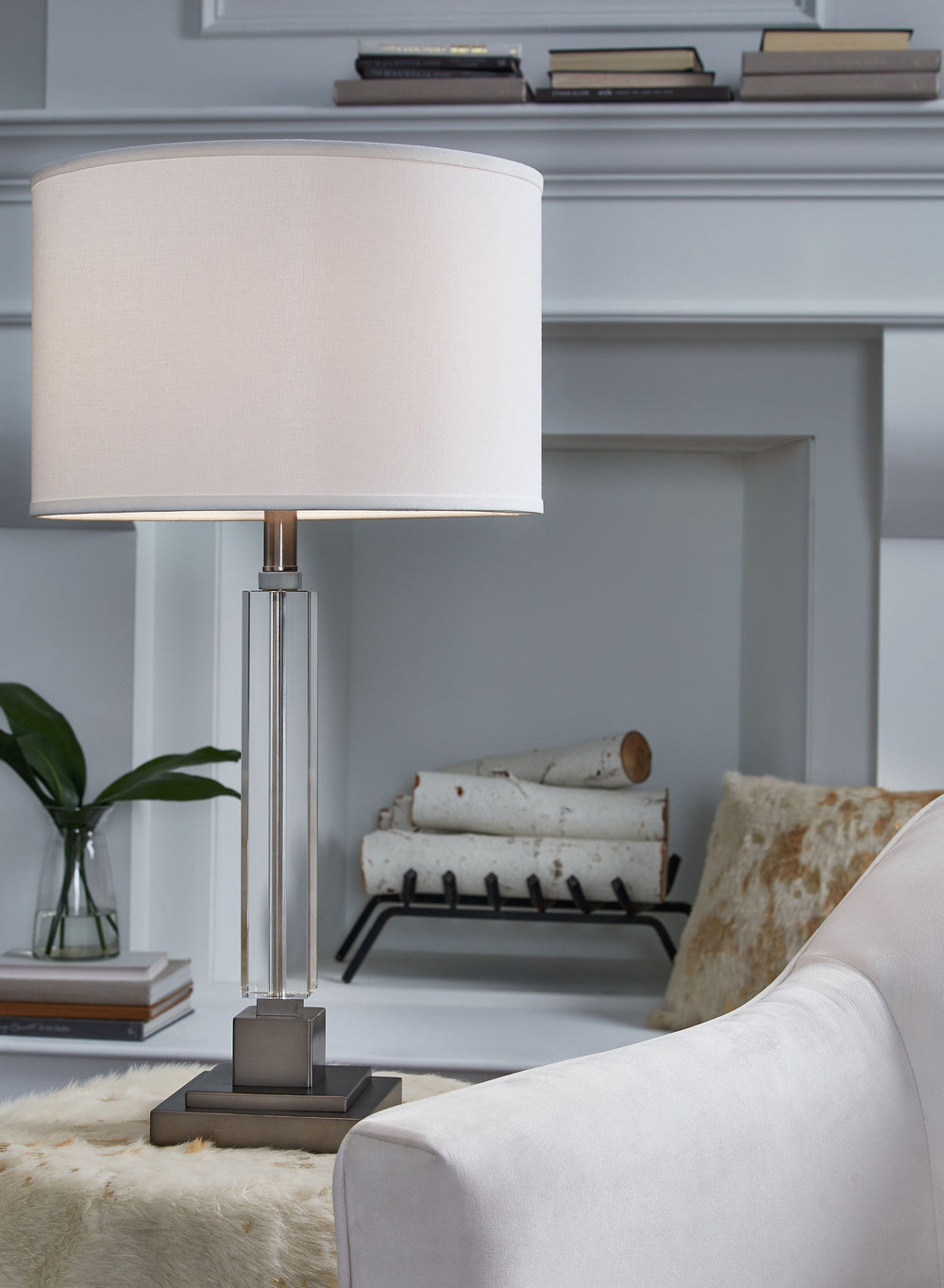 A chic take on classic candlestick style, this crystal table lamp is sheer perfection with a clean, transitional aesthetic. Touches of metal and a crisp, fabric shade keep the look light and lovely.<br><br><b>Additional Dimensions</b><br><ul><li>Shade: 0-
