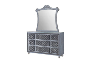 Indulge in the opulence and luxury of this exquisite bedroom collection, where classic glamour meets contemporary design. The grandeur of the tufted, upholstered headboard is framed by an elegantly sculpted silhouette, complemented by the plush finish tha