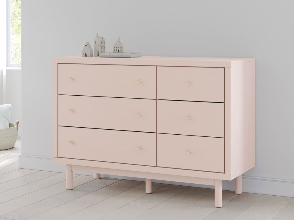 Pretty in pink. This dresser keeps the spirit of your homeâ€™s modern aesthetic while suiting all your young oneâ€™s needs. Its subtle blush finish brings a playful, charming vibe to organizing clothes and other essentials. Made for her and styled for you