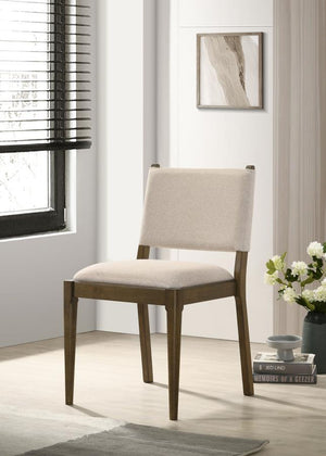  it adds a sophisticated touch to your dining space. Upholstered in soft light tan fabric