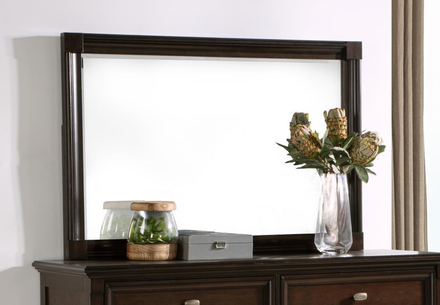 This dresser mirror enhances any room with its simple yet elegant design. The clean lines and dark oak frame bring a sense of warmth and sophistication, perfectly complementing traditional and transitional decor styles. The generous size of the mirror ref