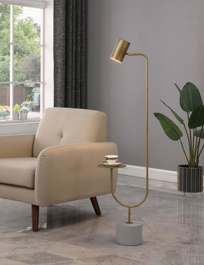 Illuminate your contemporary living room with this eye-catching, modern floor lamp. Designed in a cantilever-inspired style, this striking floor lamp presents a slim metal stand situated on a thick cement base. A slender arm in a gleaming antique brass fi