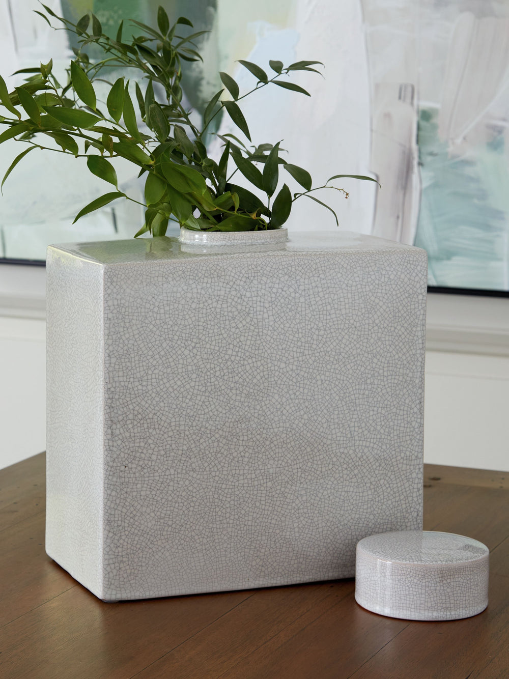 Crafted with an off-white crackle effect, this ceramic jar has a classic, antiqued feel well-fitted to new traditional spaces. Whether it-'s adding a finishing touch to your dining room or den, the accent piece brings dimensionality to your decor.<br/><br