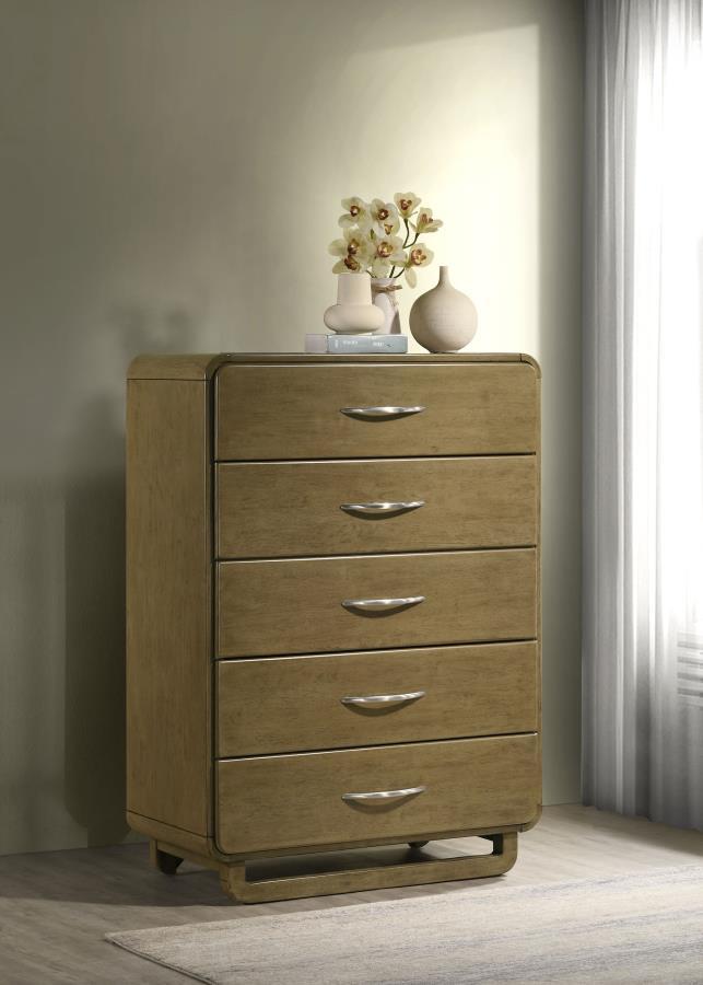 This five-drawer chest provides ample storage space while maintaining a sleek, contemporary aesthetic. The nutmeg wood finish offers a rich and inviting feel, while the rounded corners soften the design for a modern look. Each drawer is fitted with metal 