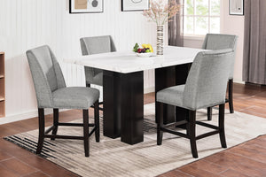 The Faust 5 Piece Counter Dining Set combines unparalleled luxury with exceptional craftsmanship, making it an exquisite addition to any dining space. This set includes a stunning white faux marble counter dining table and four elegantly upholstered Parso