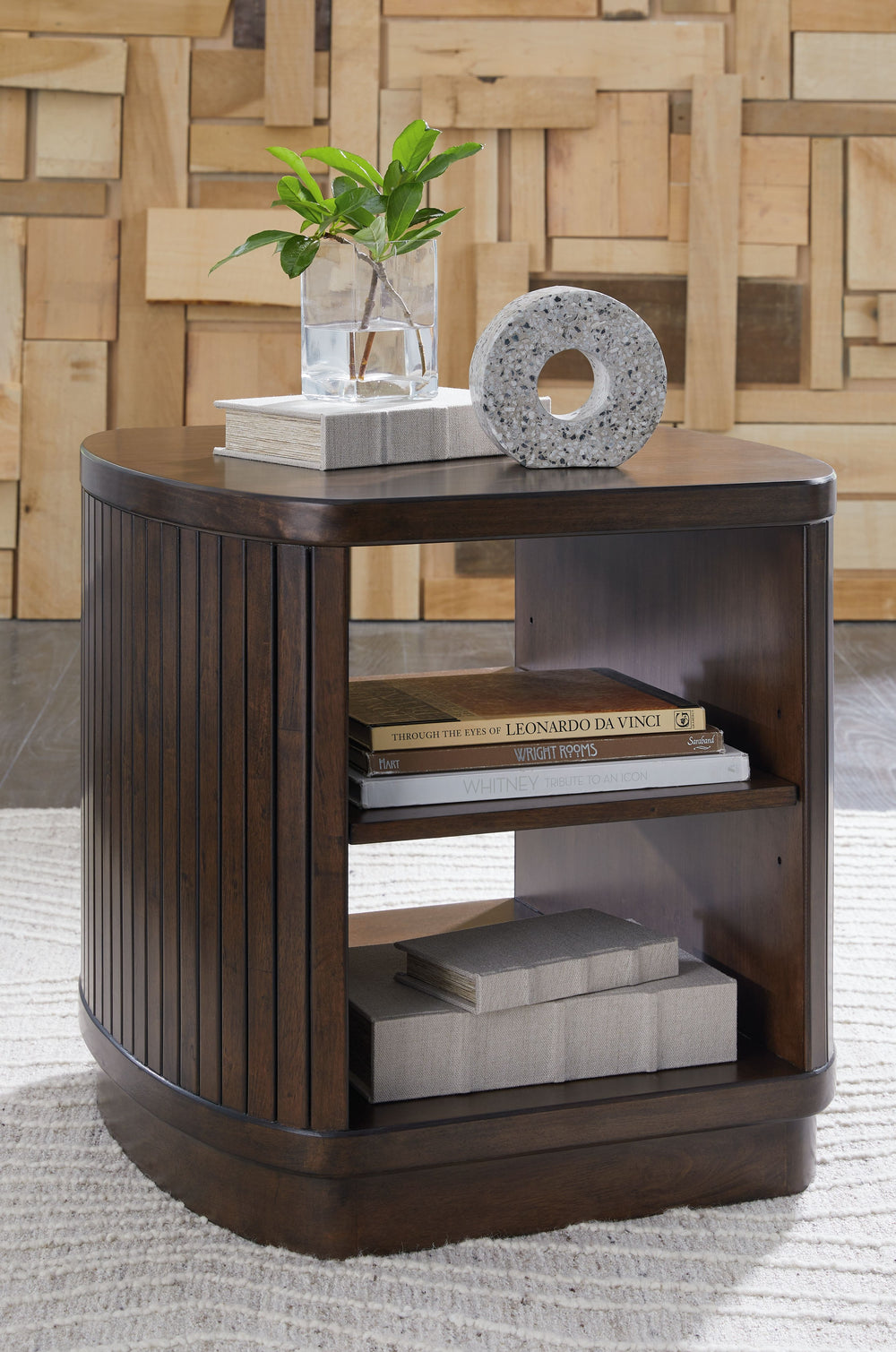 This richly finished end table makes life easyâ€”in a casual contemporary kinda way. When you-'re relaxing on the couch, this piece makes reaching for the remote or a snack a breeze. A spacious lower shelf is ideal for displaying treasures.<br><br><b>Addi