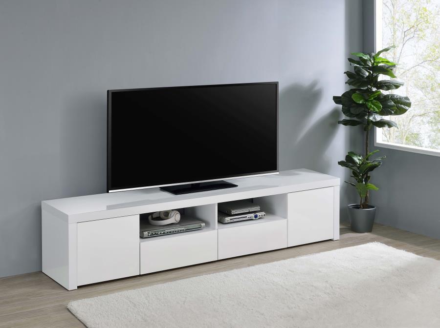 Modern low-slung design highlights a contemporary media console. Perfect for a modern television, either mounted above or sitting on top, the TV stand offers various storage spaces to keep media and gaming components and accessories tidy and organized. A 