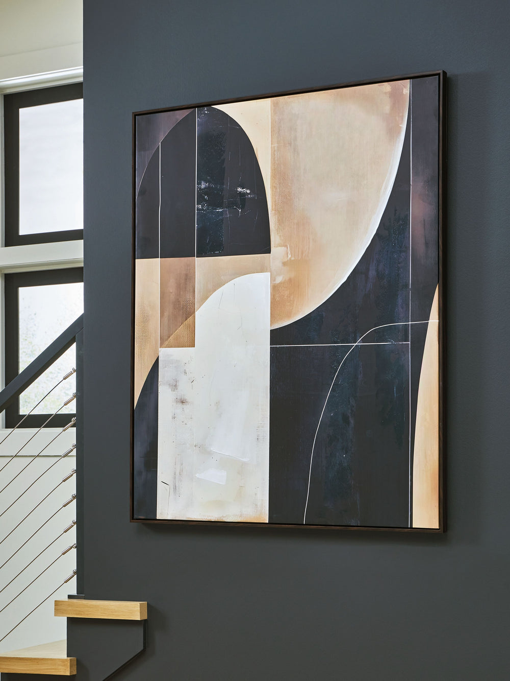 Geometric forms are layered to create the dynamic character of this wall art. Abstract in shades of black, brown and tan, itâ€™s a statement piece well-suited to a contemporary living room or office. Change its styling as you pleaseâ€”this artwork can han