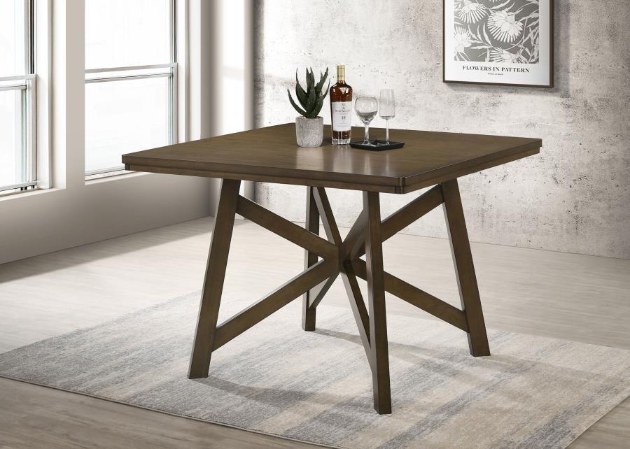 Elevate your dining space with this 47-inch square counter height dining table, perfect for creating a cozy yet stylish dining area. Crafted with engineered wood, hardwoods, and finished with a beautiful mindi veneer, this table showcases natural wood str