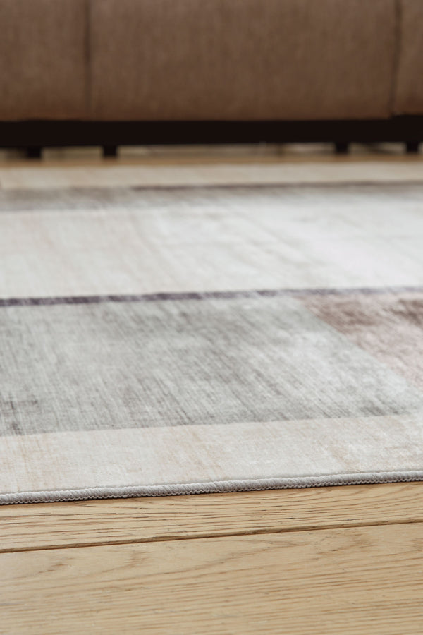  neutral tones of this rug make an artistic impression