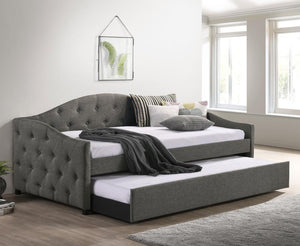  this daybed and trundle combo lends traditional elements such as a button-tufte