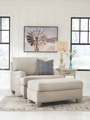 For a fresh spot in your space, turn to this designer chair and ottoman. Wind down at the end of a long day when you sink into this canyon of comfort. <h4><b>Traemore - Linen - Chair and a Half</b></h4> <table width=-"100%-"><colgroup><col style=-"width: 