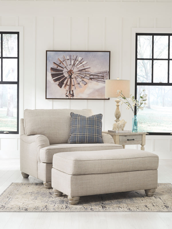 For a fresh spot in your space, turn to this designer chair and ottoman. Wind down at the end of a long day when you sink into this canyon of comfort. <h4><b>Traemore - Linen - Chair and a Half</b></h4> <table width=-"100%-"><colgroup><col style=-"width: 