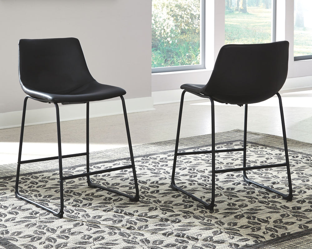 With its distinctive contoured bucket seat and tubular metal base, this striking bar stool serves up a fresh twist on mid-century inspired style. Faux leather upholstery has a charmingly vintage tone and a color-coordinated frame. What a timeless look for