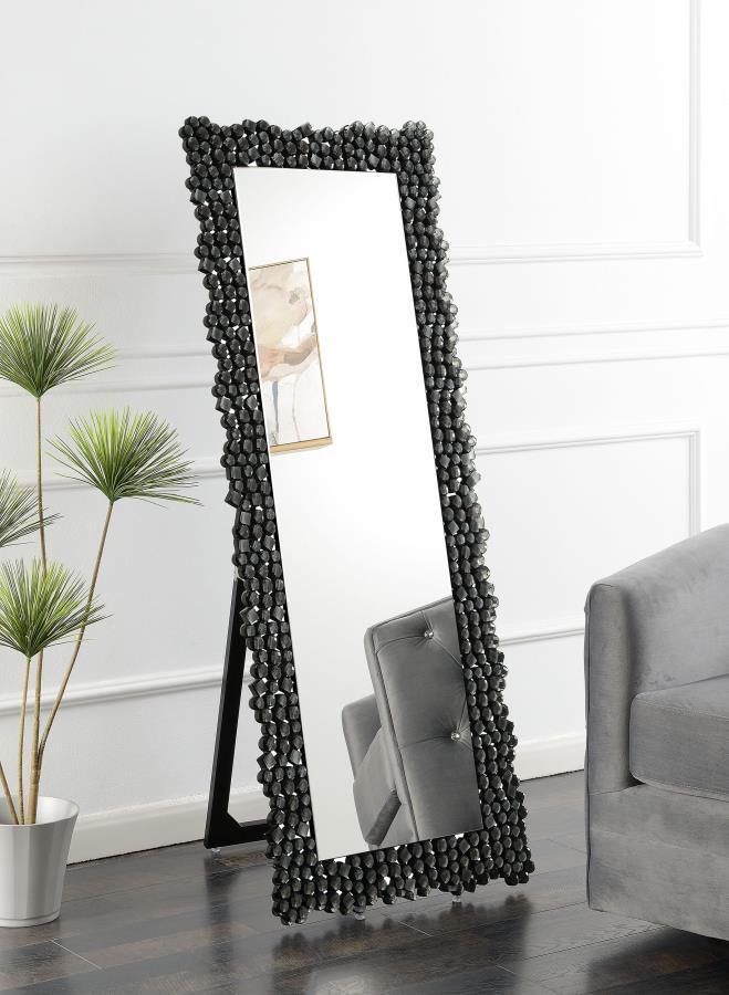 This standing mirror brings bold dimension and sparkle with its dramatic frame of faceted acrylic crystals. Designed to stand freely with an integrated easel back, it delivers a full-length view while doubling as a decorative statement. The crystal-like a