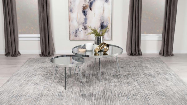  with the smaller table tucking underneath its larger counterpart to conserve space o