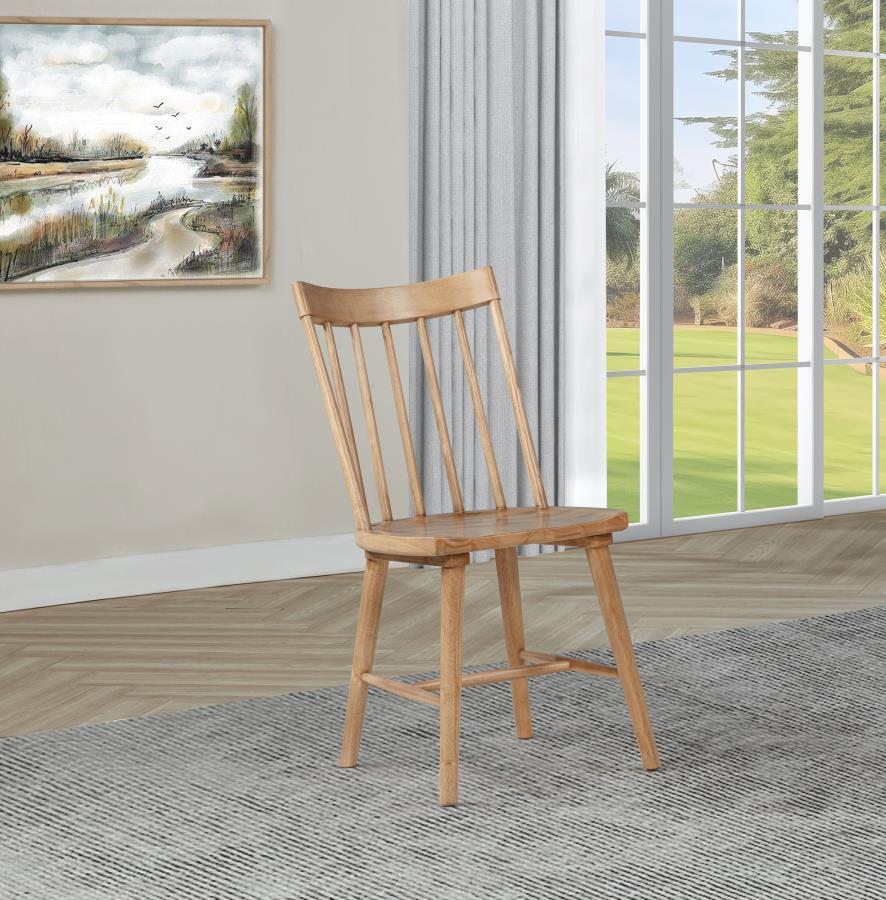 This modern Windsor-style dining side chair refreshes a classic silhouette with a trendy finish, creating a sleek, contemporary accent in any dining room. Built from solid hardwood, it ensures sturdy support and everyday durability. Its slender spindles a