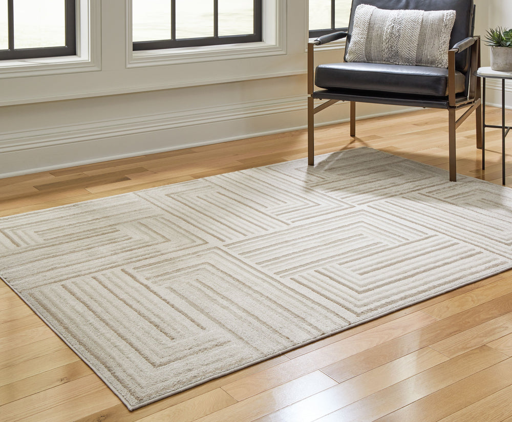 Seeking warmth and coziness for your home? This area rug is the perfect choice. With its high-low pile and neutral-hued geometric design, it seamlessly blends with both modern and traditional decor styles. Experience the inviting ambiance this rug brings 
