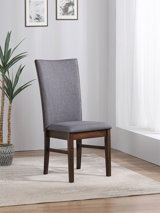 This elegant dining side chair combines comfort and sophistication, making it the perfect complement to any dining table. Upholstered in soft gray fabric on both sides of the backrest and the seat, it offers a cohesive and refined look. The sturdy frame i