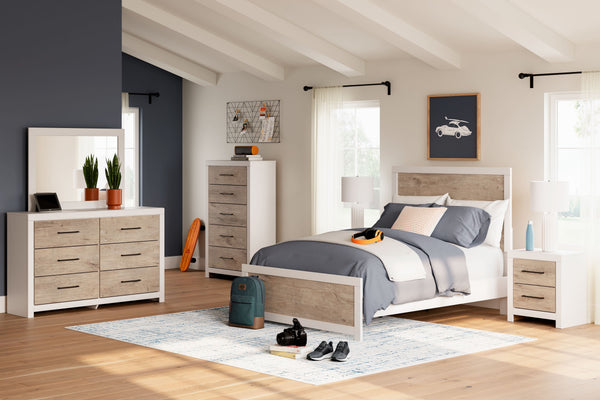Two toned with a matte white finish and a dry, light finish with replicated oak grain and authentic touch. Cases feature a framed front and pilasters. Contemporary handles in an antiqued gunmetal finish. Side roller glides for smooth operating drawers. Dr