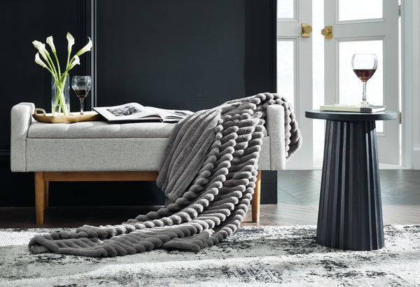 this faux fur throw turns your seating area into a haven of comfort. Its neutral hue acts as the perfect foundation for layering