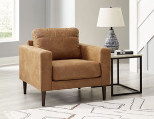  tailored to perfection. This chair echoes retro aesthetics with warm caramel faux leather